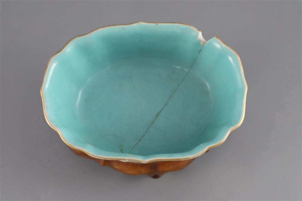 A Chinese ruby ground jardiniere, Daoguang mark and of the period (1821-50), 17cm wide, 6.5cm high, wood stand